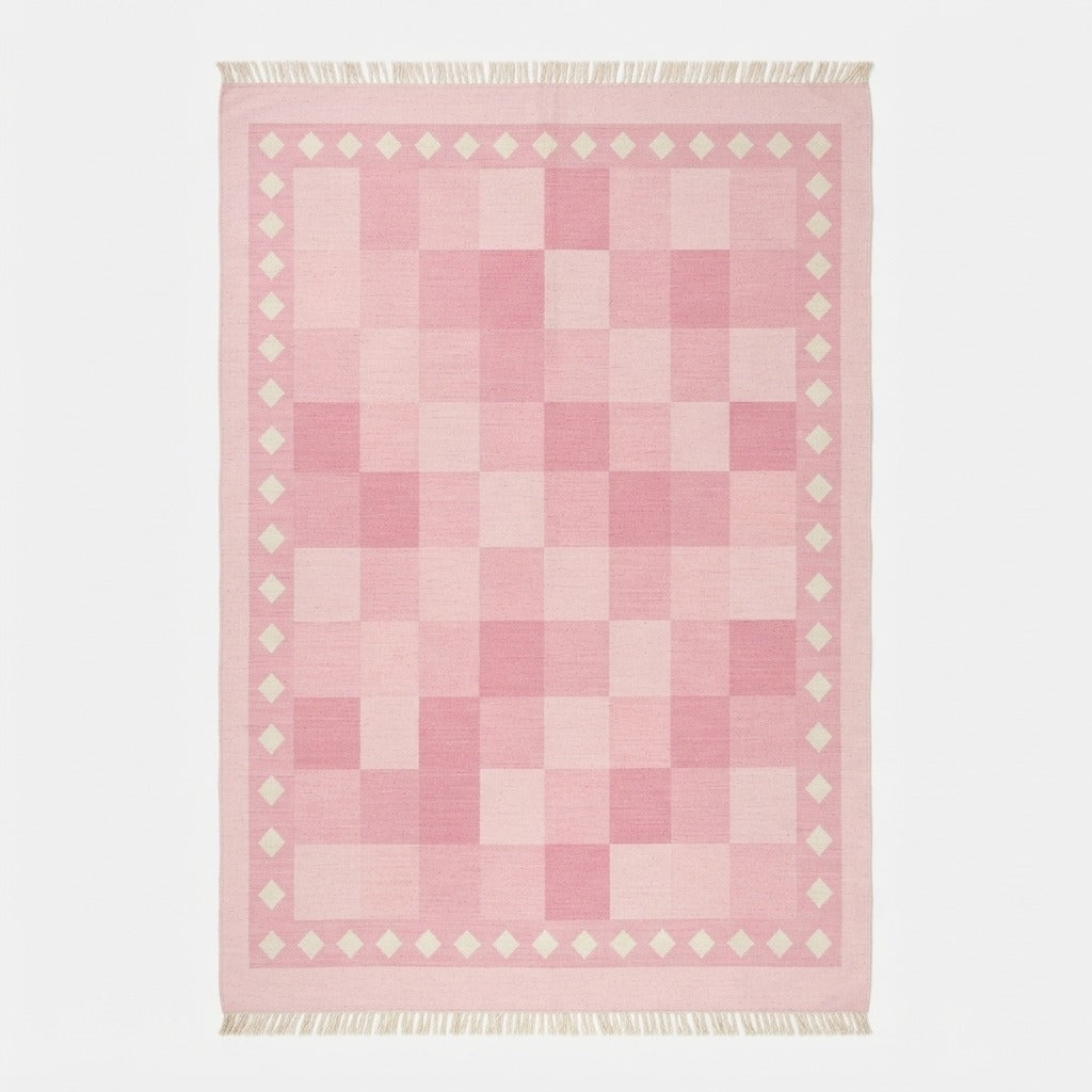 Blush Pink Checkerboard Cotton Flat Weave Rug with Ivory Diamond Border - studio photo
