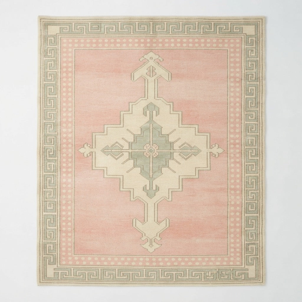 Blush Pink Hand-Knotted Rug with Ivory Medallion and Greek Key Border - studio photo