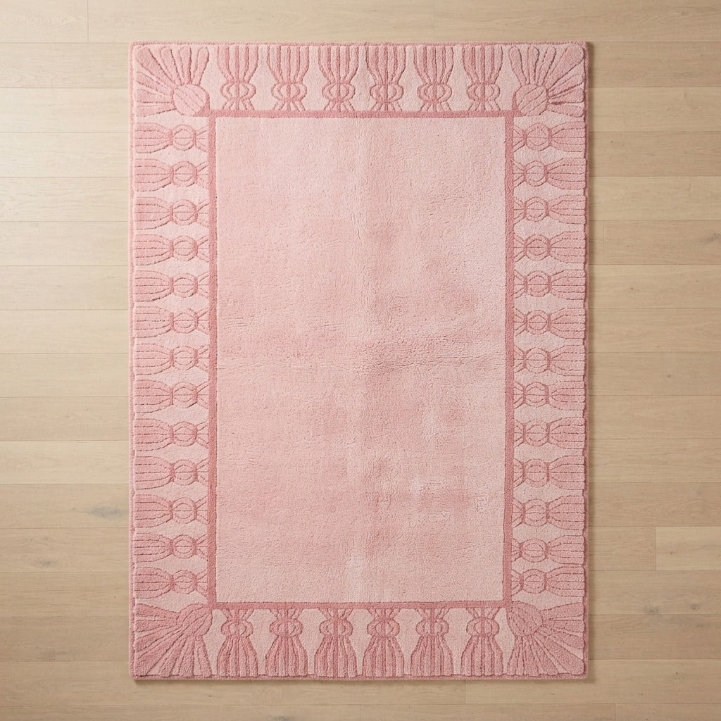 Blush Pink Hand-Tufted Rug with Carved Fan Tassel Border - studio photo