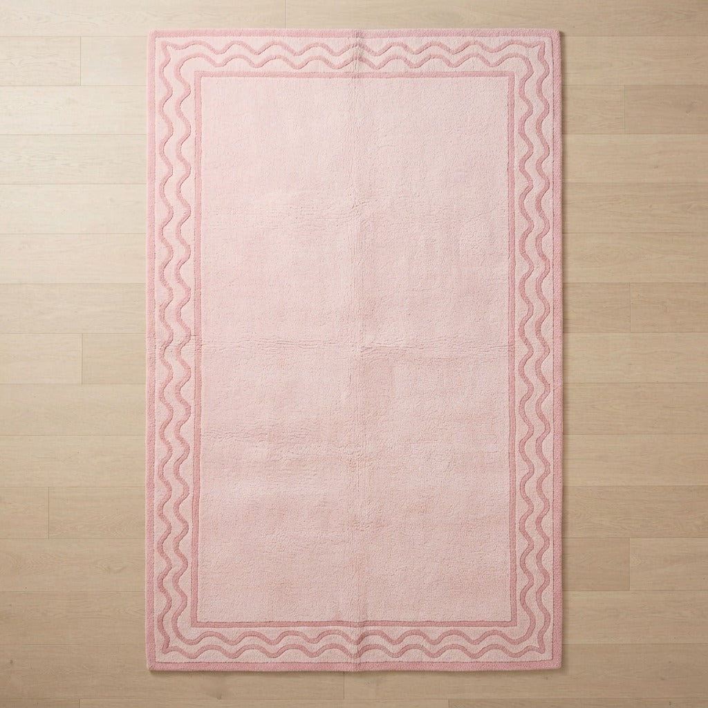 Blush Pink Hand-Tufted Rug with Rose Wave Border - studio photo
