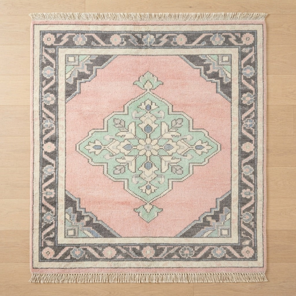 Blush Pink Medallion Hand-Knotted Rug with Mint and Charcoal Border - studio photo