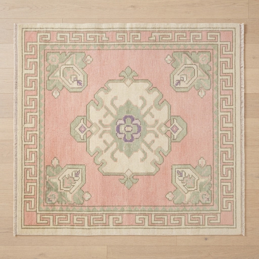 Blush Pink Medallion Square Hand-Knotted Rug with Ivory Greek Key Border - studio photo