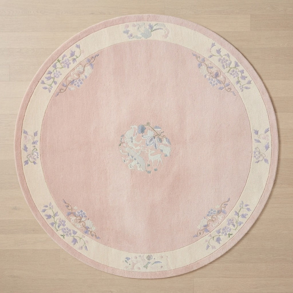 Blush Pink Round Chinese Art Deco Hand-Knotted Rug with Ivory Border - studio photo