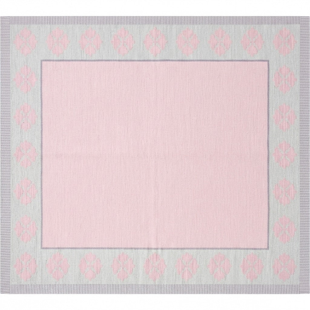 Blush Pink Square Cotton Flat Weave Rug with Grey Floral Medallion Border - studio photo