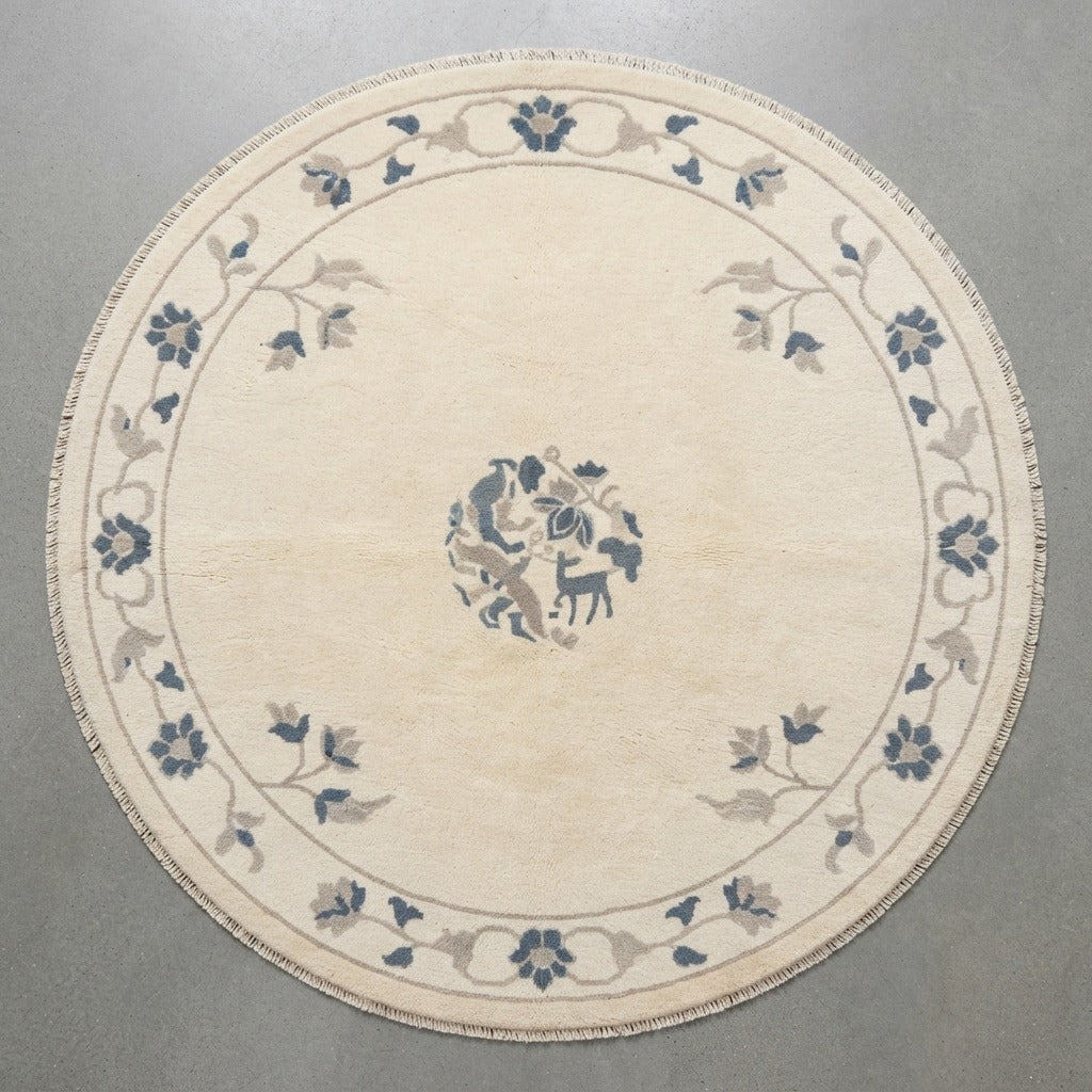 Cream Round Chinese Art Deco Hand-Knotted Rug with Slate Blue Florals - studio photo
