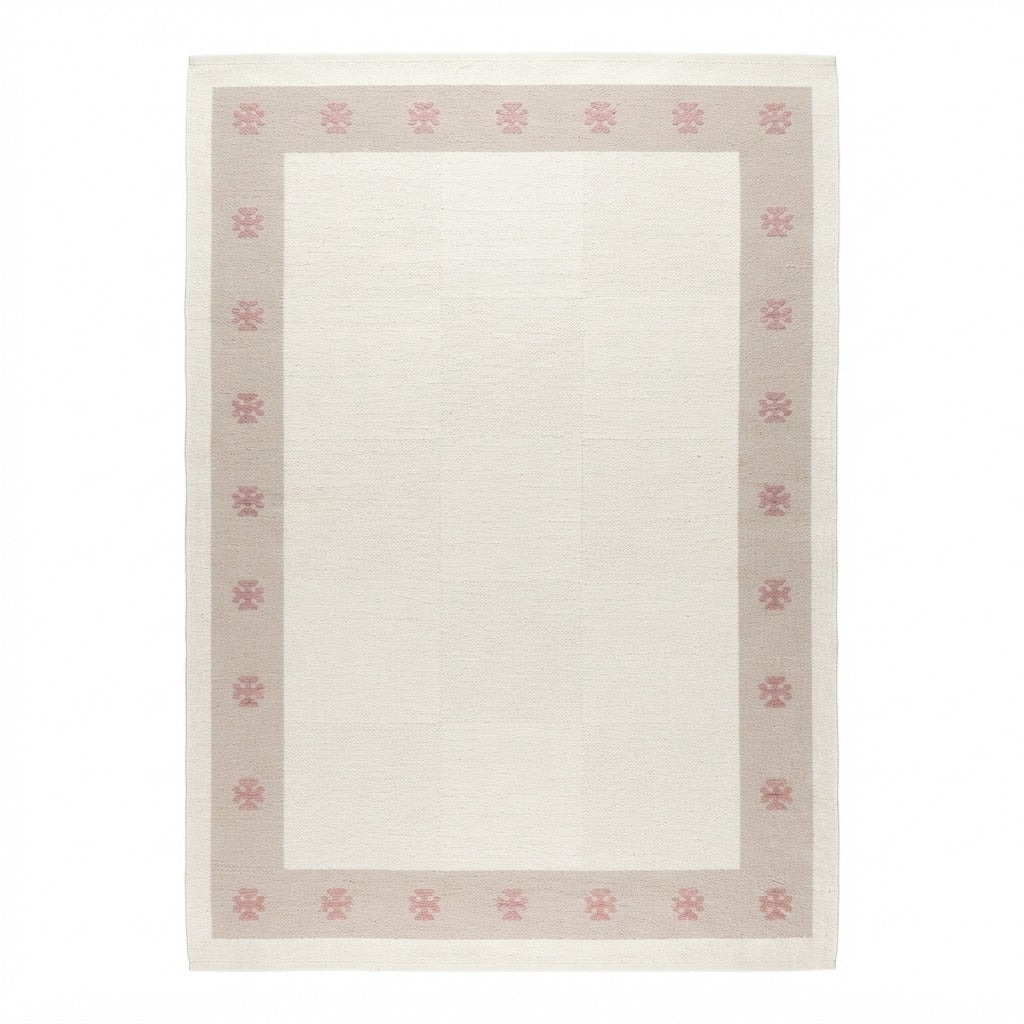 Ivory Cotton Flat Weave Rug with Pink Star Taupe Border - studio photo