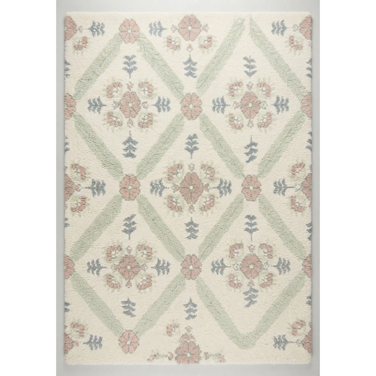 Ivory Floral Trellis Hand-Tufted Rug with Sage and Blush Accents - studio photo
