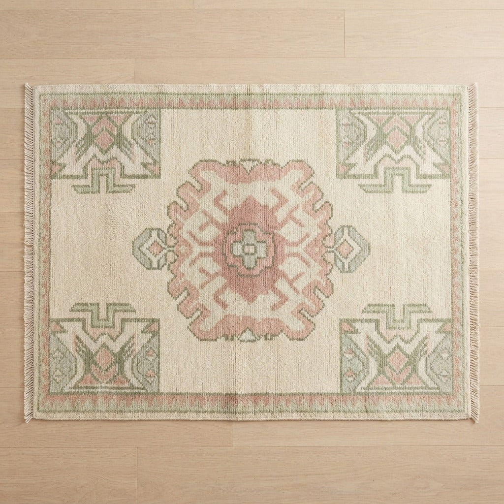 Ivory Hand-Knotted Rug with Dusty Rose Medallion and Sage Motifs - studio photo