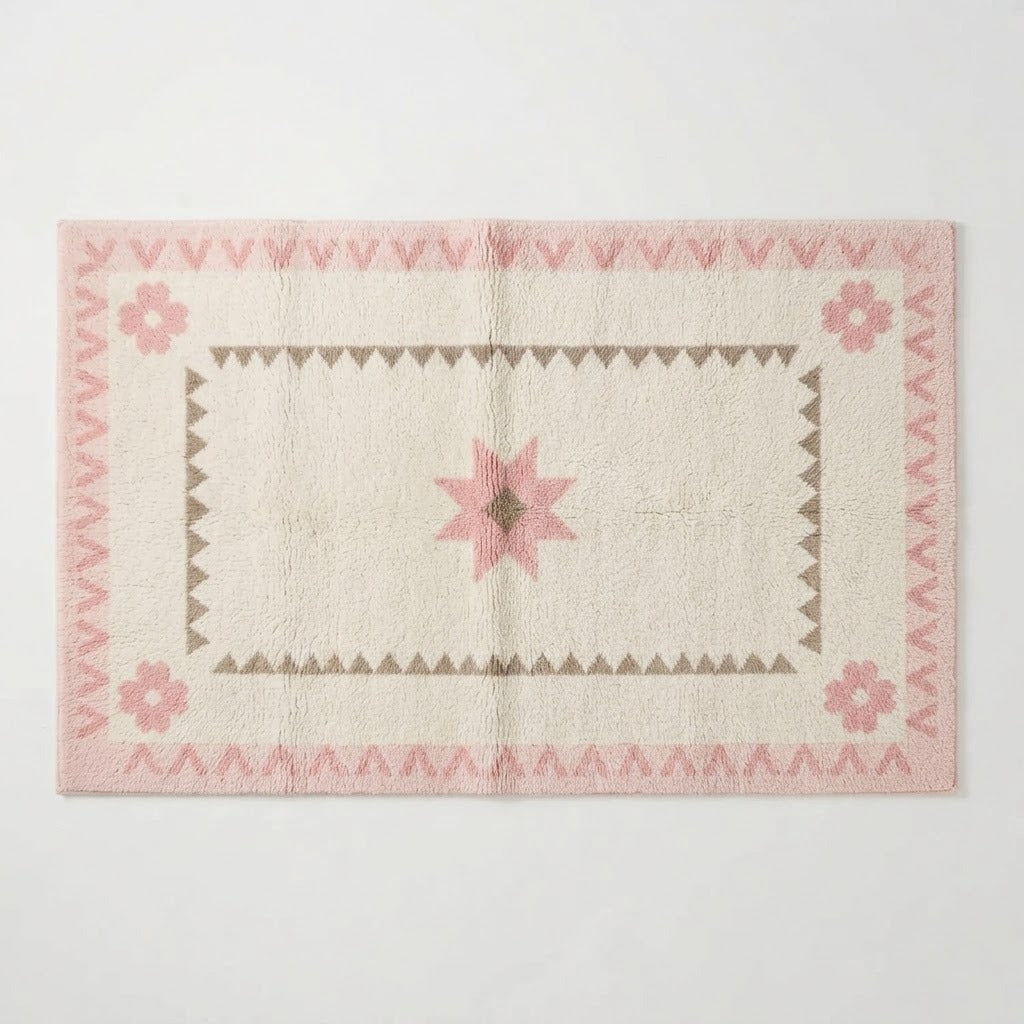 Ivory Hand-Tufted Rug with Blush Star and Sawtooth Border - studio photo