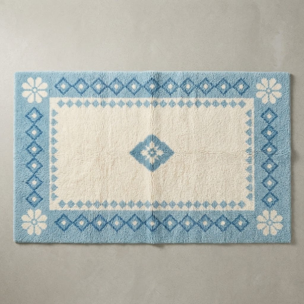 Ivory Hand-Tufted Rug with Sky Blue Diamond Border and Daisy Corners - studio photo