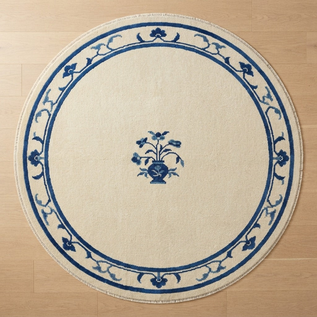 Ivory Round Hand-Knotted Rug with Cobalt Floral Vine Border - studio photo