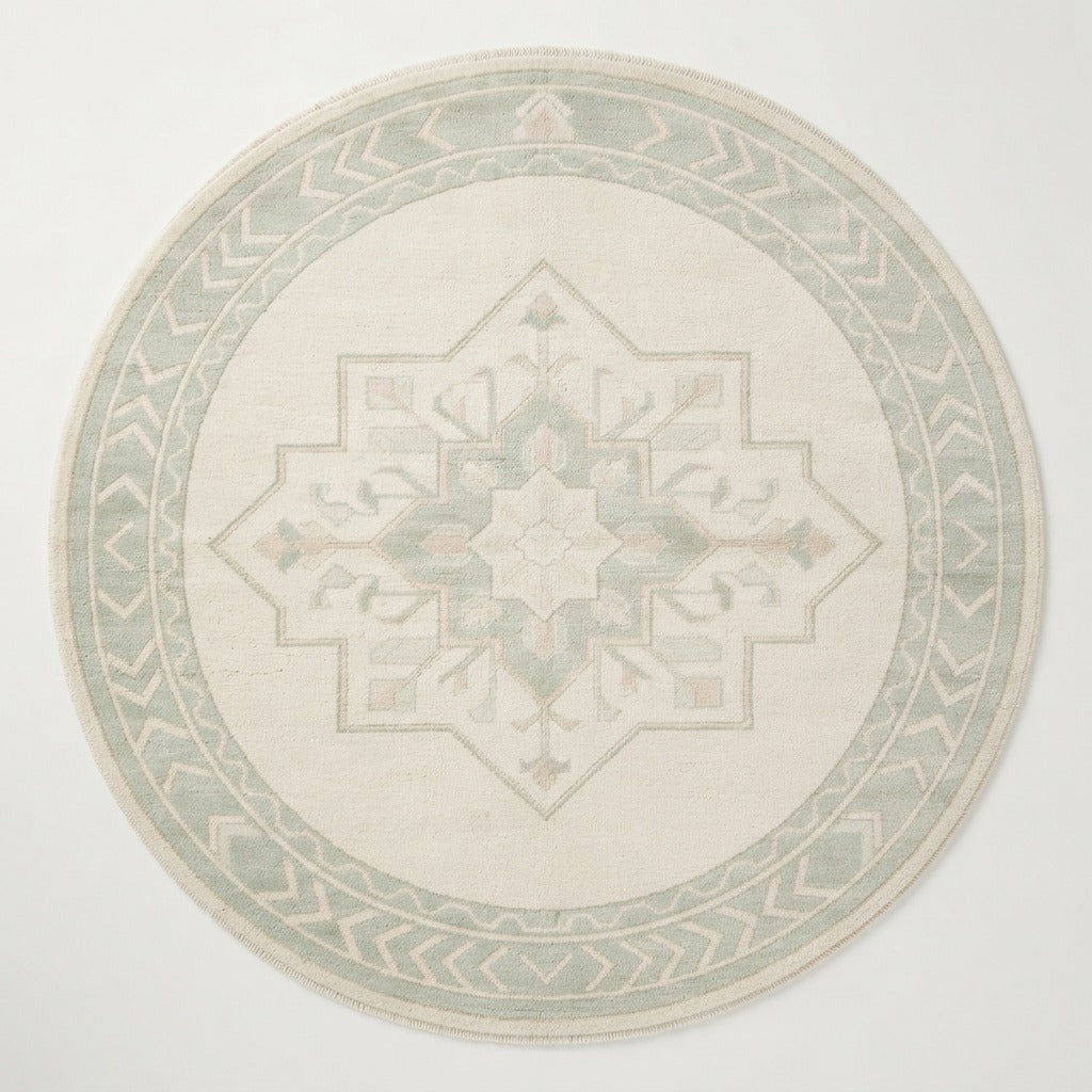 Ivory Round Medallion Hand-Knotted Rug with Sage Chevron Border - studio photo