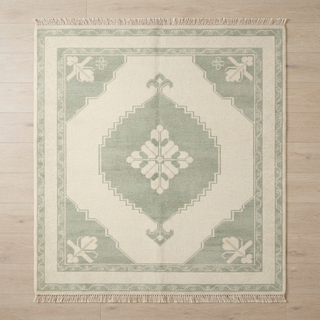 Ivory and Sage Stepped Medallion Square Hand-Knotted Rug - studio photo