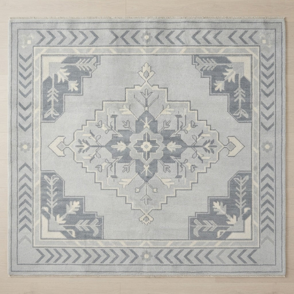 Light Blue and Slate Grey Medallion Hand-Knotted Rug with Chevron Border - studio photo