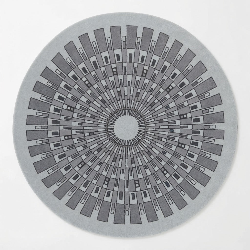 Light Grey Round Hand-Tufted Rug with Charcoal Art Deco Sunburst - studio photo