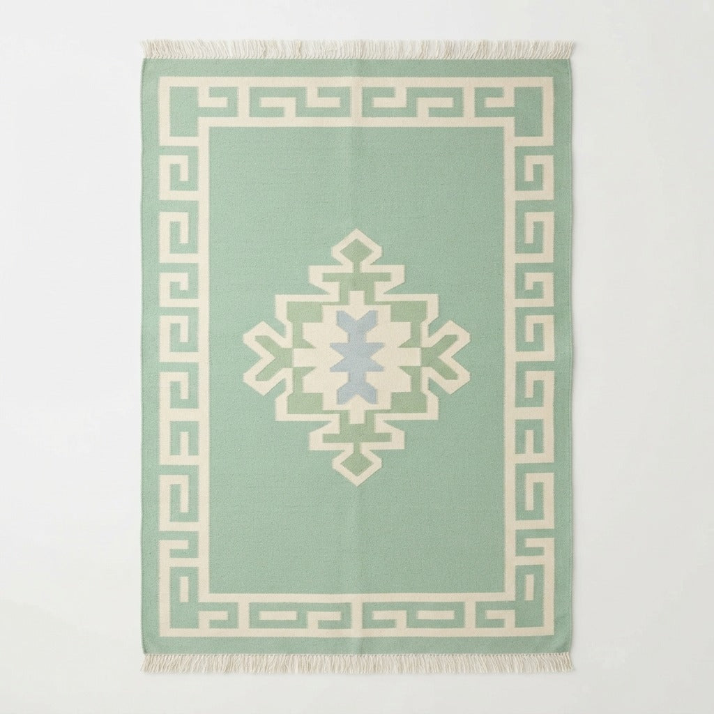 Mint Green Cotton Flat Weave Rug with Ivory Tribal Medallion - studio photo