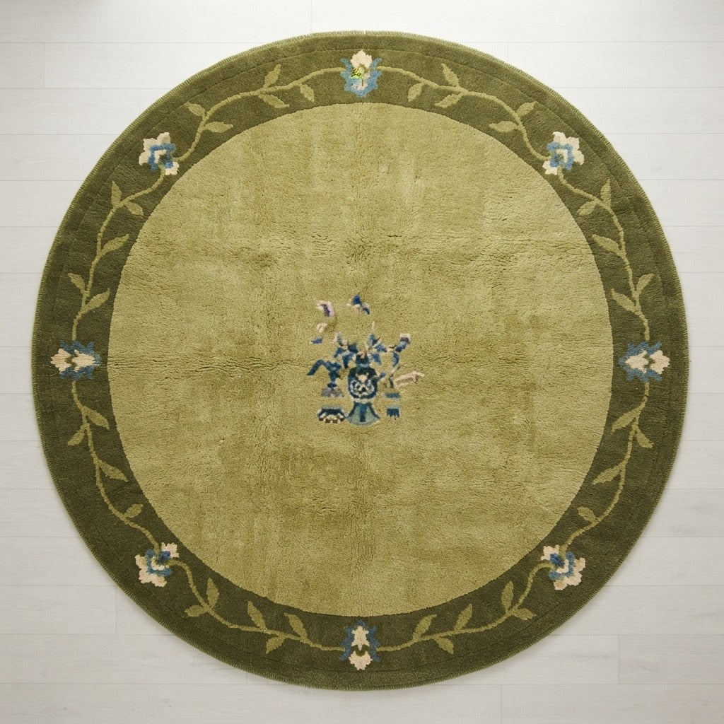 Moss Green Round Hand-Knotted Rug with Olive Floral Vine Border - studio photo