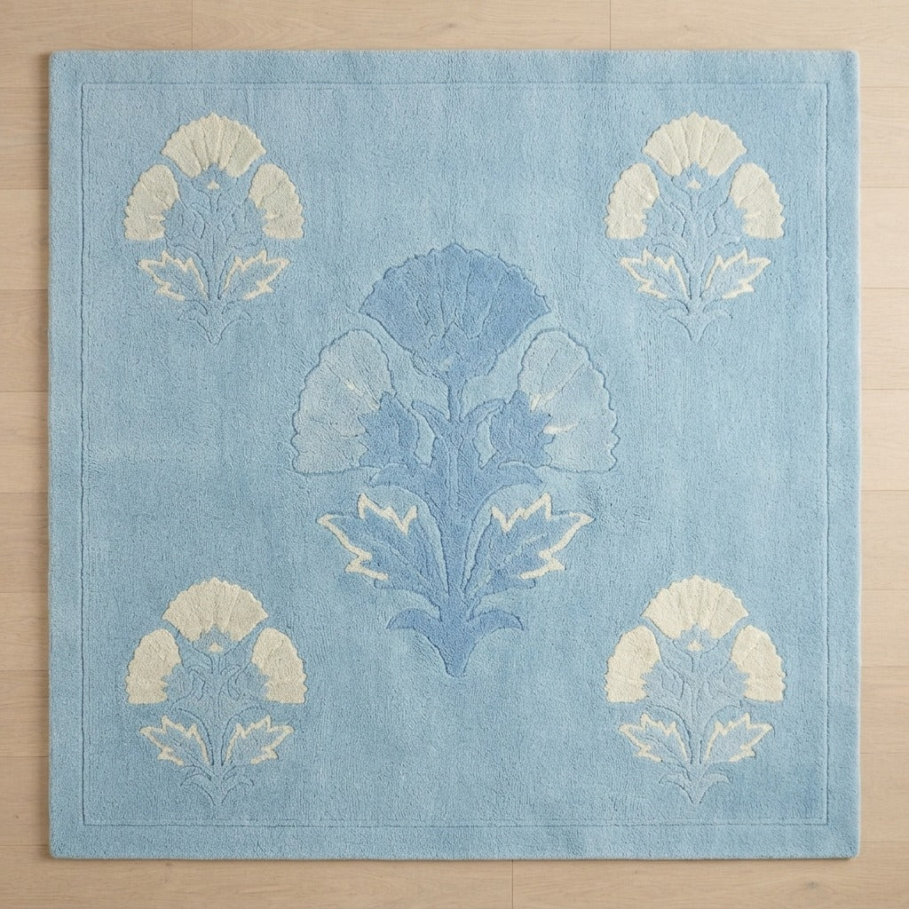 Powder Blue Hand-Tufted Rug with Cream and Cornflower Poppy Motifs - studio photo