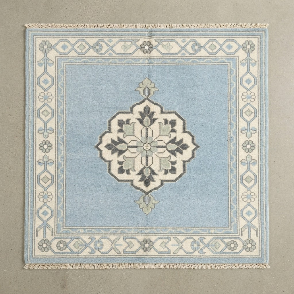 Powder Blue Square Hand-Knotted Rug with Ivory Floral Border and Grey Medallion - studio photo