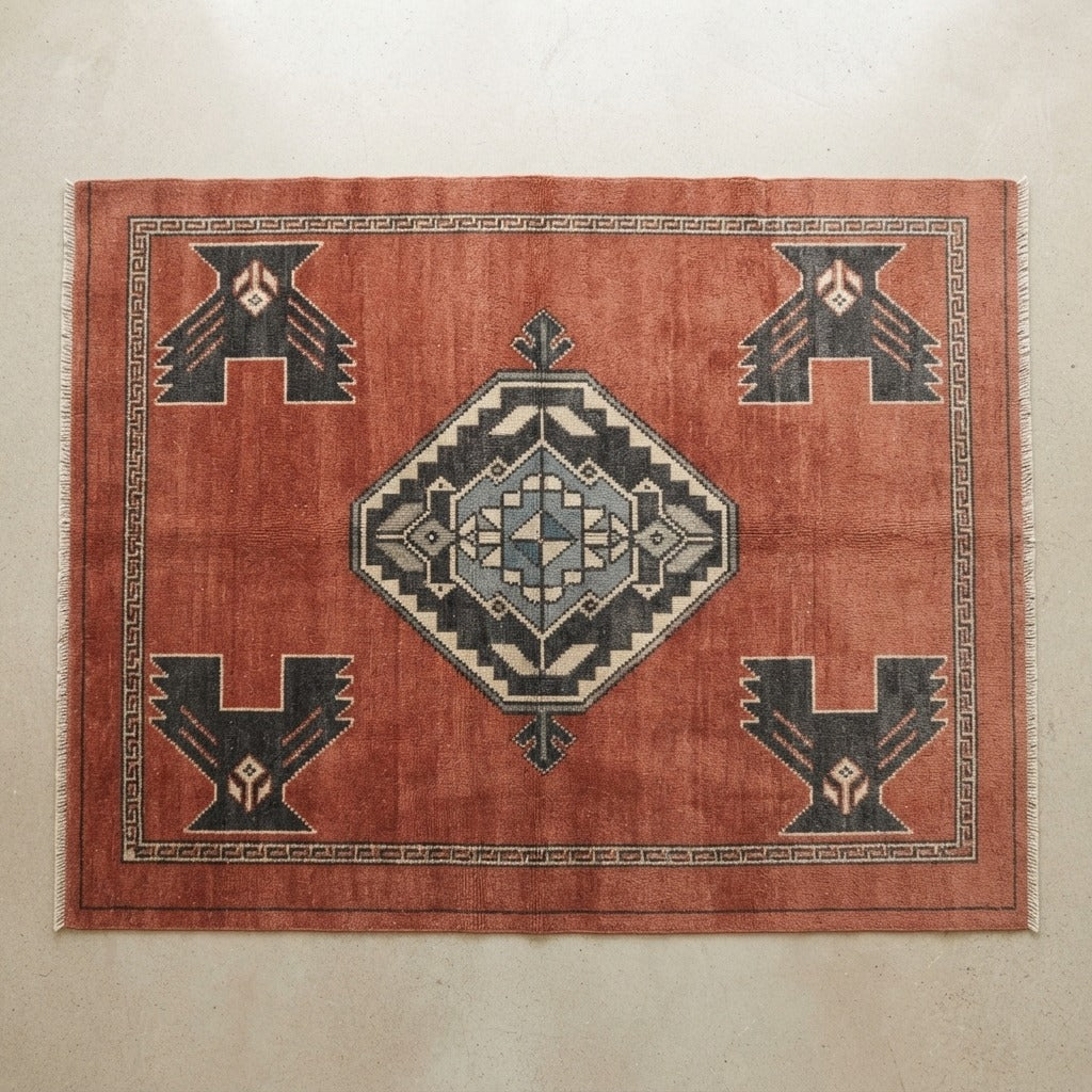 Rust Hand-Knotted Rug with Charcoal Tribal Diamond Medallion - studio photo