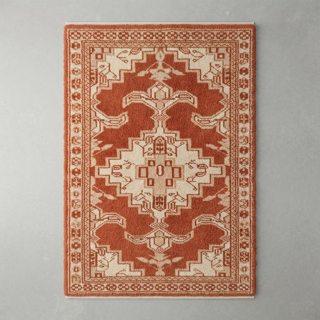 Rust Red Medallion Hand-Knotted Rug with Ivory Floral Border - studio photo