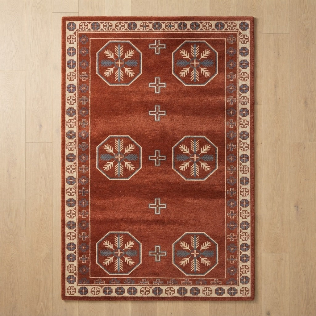 Rust Tribal Octagon Hand-Tufted Rug with Ivory Snowflake Motifs - studio photo