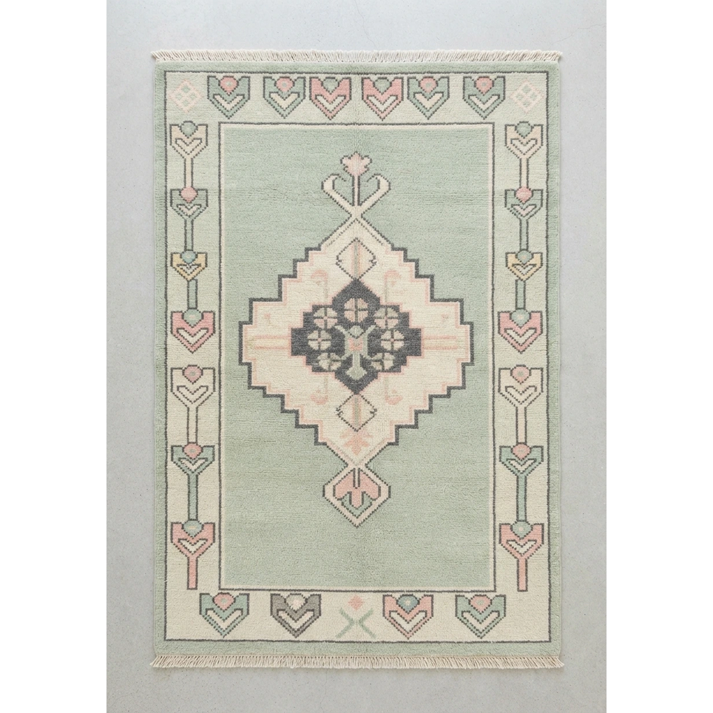 Sage Green Hand-Knotted Rug with Blush Medallion and Tulip Border - studio photo