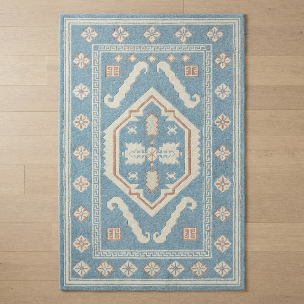Sky Blue Tribal Medallion Hand-Tufted Rug with Cream Star Border - studio photo
