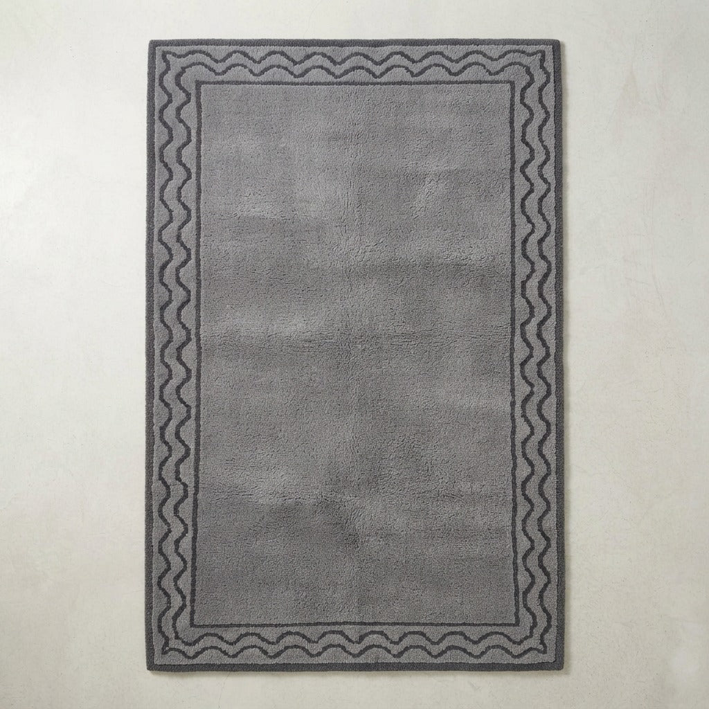 Slate Grey Hand-Tufted Rug with Charcoal Wave Border - studio photo