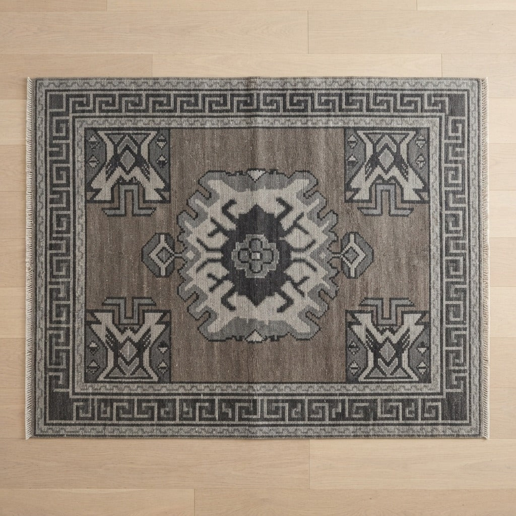 Taupe Grey Hand-Knotted Rug with Charcoal Medallion and Greek Key Border - studio photo