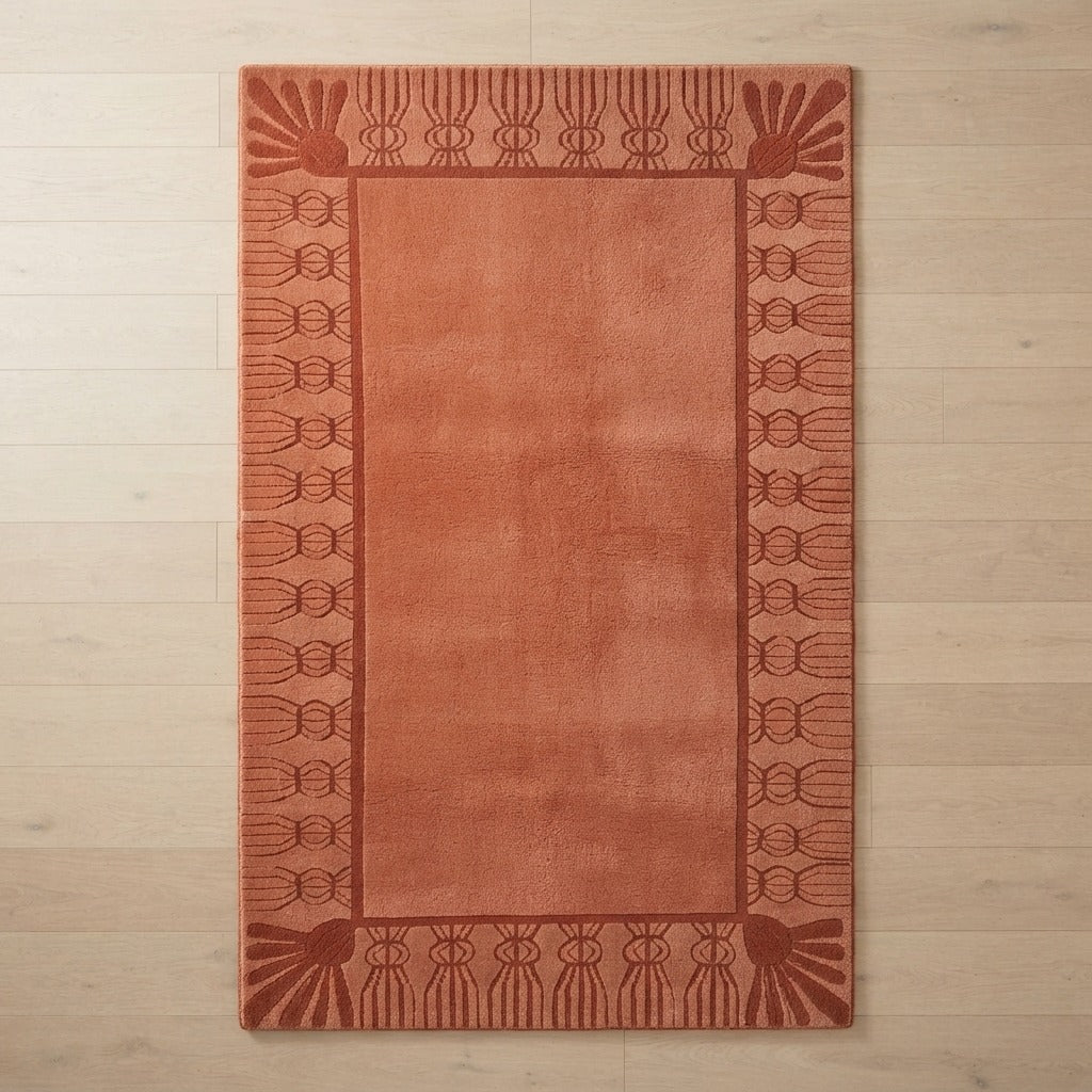 Terracotta Hand-Tufted Rug with Rust Carved Fan Border - studio photo